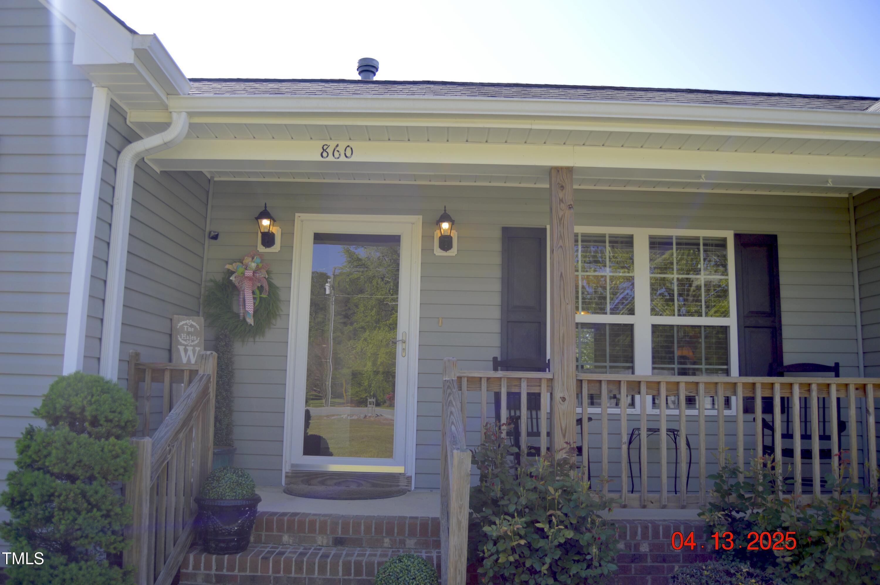 860 Bear Road Benson, NC 27504 - Photo 5 of 42 a front view of a house with a porch