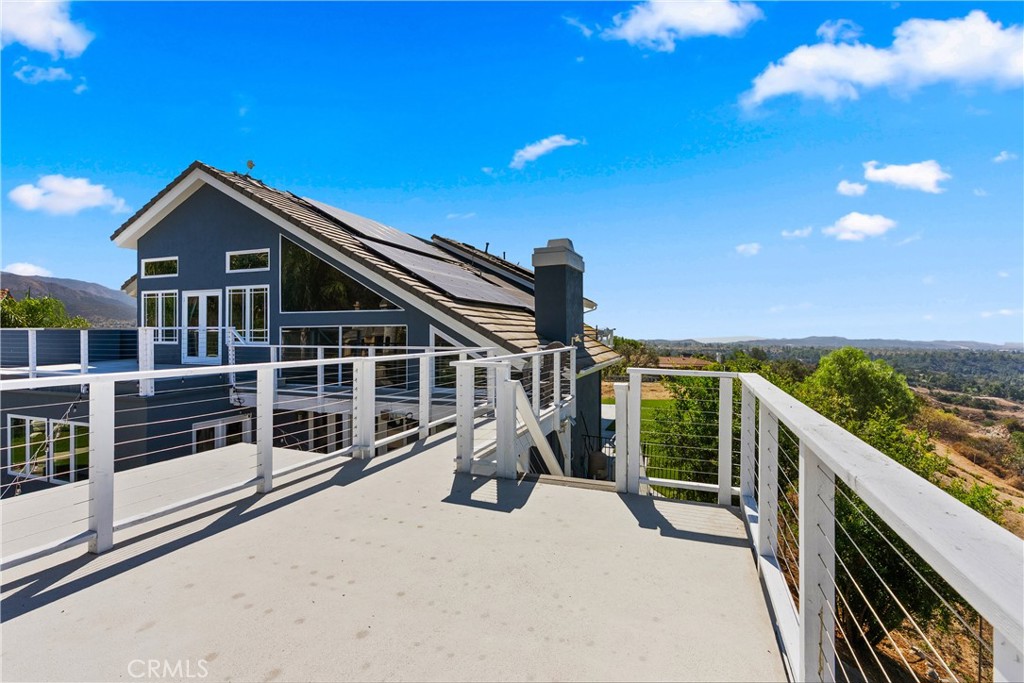 3 Windy Ridge Road Trabuco Canyon, CA 92679 - Photo 24 of 59 a roof deck with table and chairs