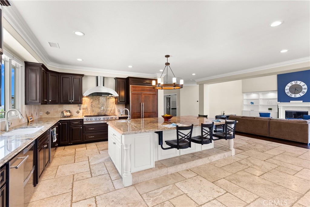 3 Windy Ridge Road Trabuco Canyon, CA 92679 - Photo 29 of 59 a kitchen with stainless steel appliances kitchen island granite countertop a sink and cabinets