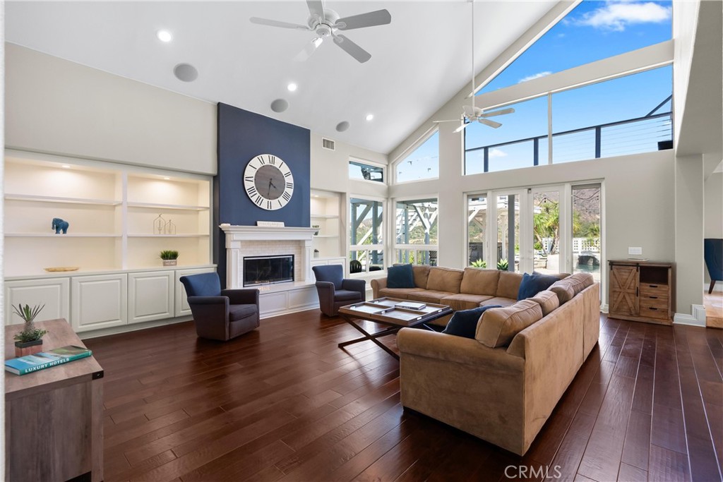 3 Windy Ridge Road Trabuco Canyon, CA 92679 - Photo 32 of 59 a living room with fireplace furniture and a large window