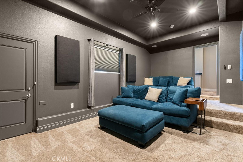3 Windy Ridge Road Trabuco Canyon, CA 92679 - Photo 35 of 59 a living room with furniture and a chandelier