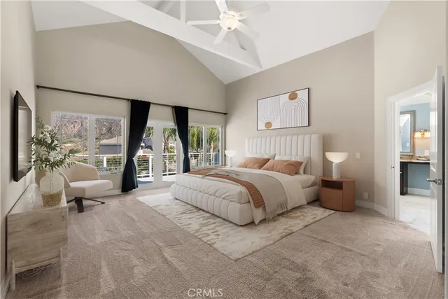 a bedroom with a bed and a couch