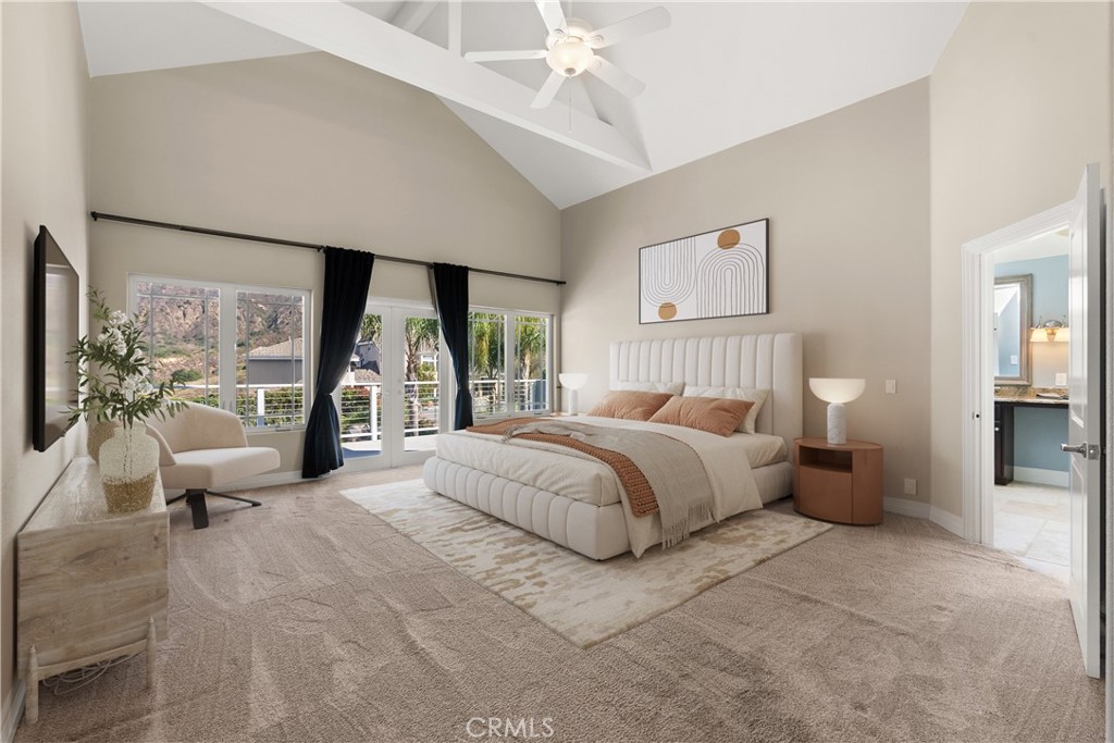 3 Windy Ridge Road Trabuco Canyon, CA 92679 - Photo 40 of 59 a bedroom with a large bed and large windows