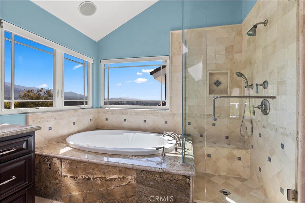3 Windy Ridge Road Trabuco Canyon, CA 92679 - Photo 41 of 59 a bathroom with a granite countertop sink and a mirror