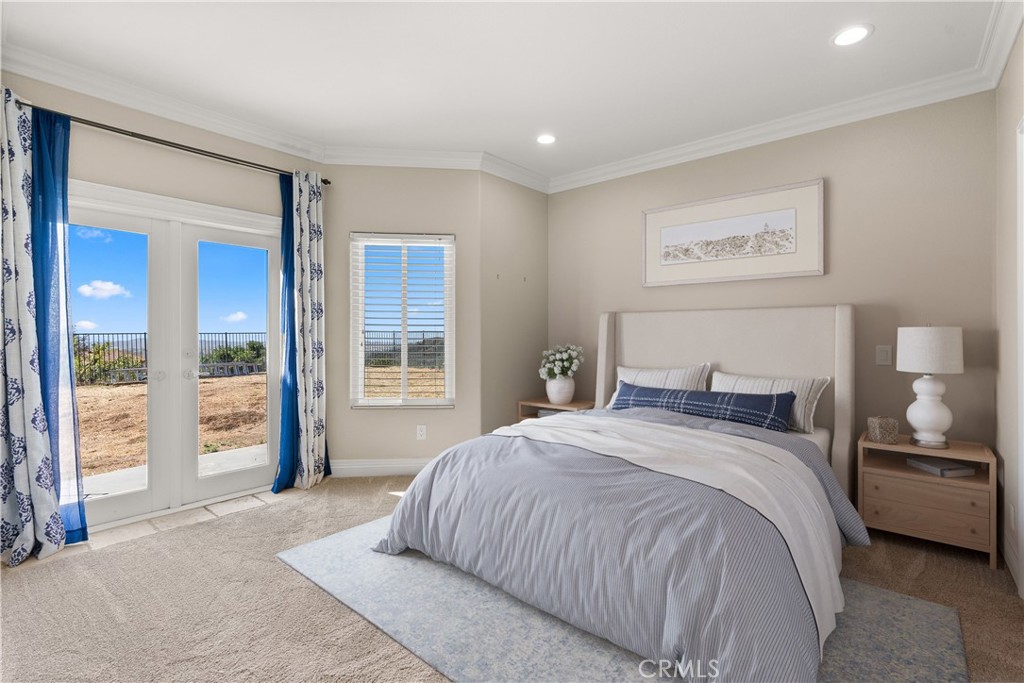 3 Windy Ridge Road Trabuco Canyon, CA 92679 - Photo 42 of 59 a bedroom with a large bed and a large window
