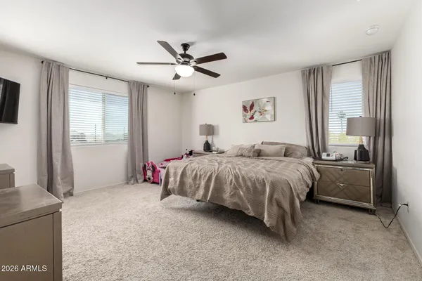 a bathroom with a sink a toilet a shower a mirror and vanity