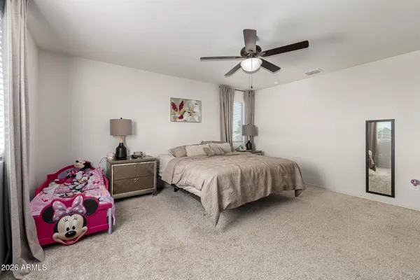 a bathroom with a sink vanity mirror and toilet