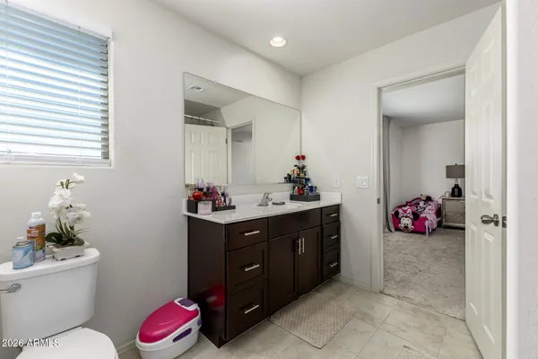 a view of a bedroom with a bed and closet