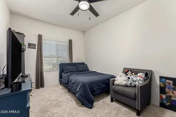 a bed room with a bed and a desk