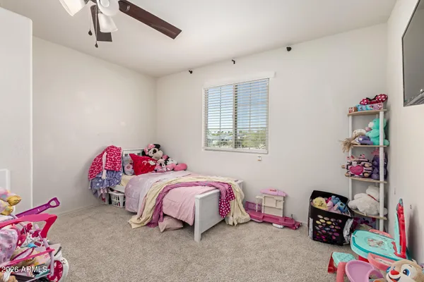 a bedroom with a bed and a cabinets