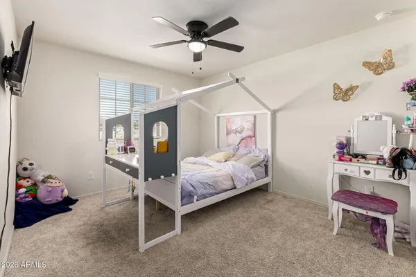 a bed room with a bed and a window