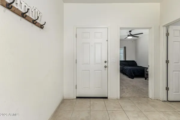 a living room with furniture and white walls