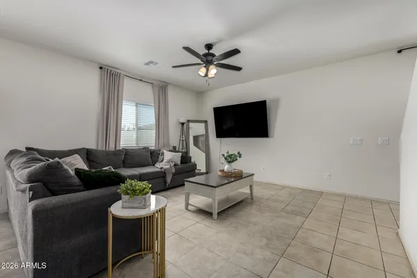 a view of a livingroom with furniture and a flat screen tv