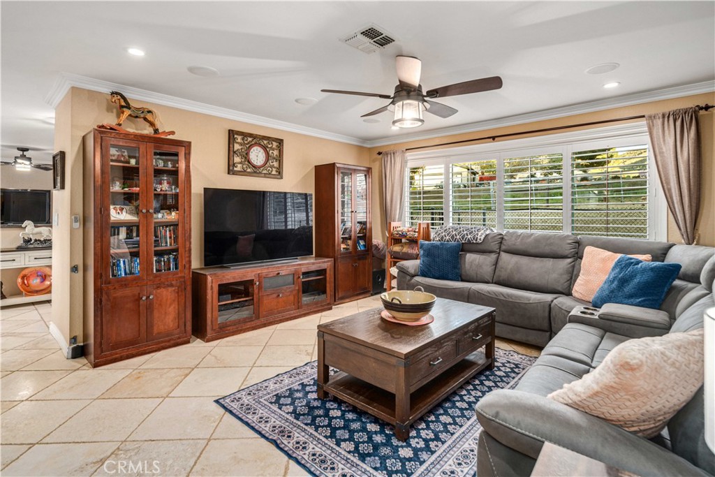 2862 Calmgarden Road Acton, CA 93510 - Photo 16 of 69 a living room with furniture a flat screen tv and a large window