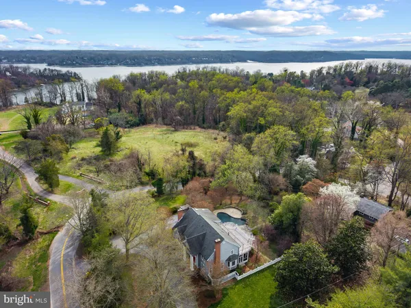 an aerial view of a house with outdoor space