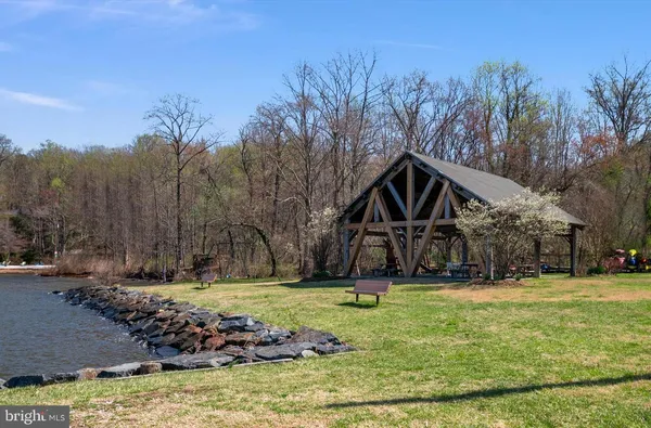a view of a house with pool yard and sitting area