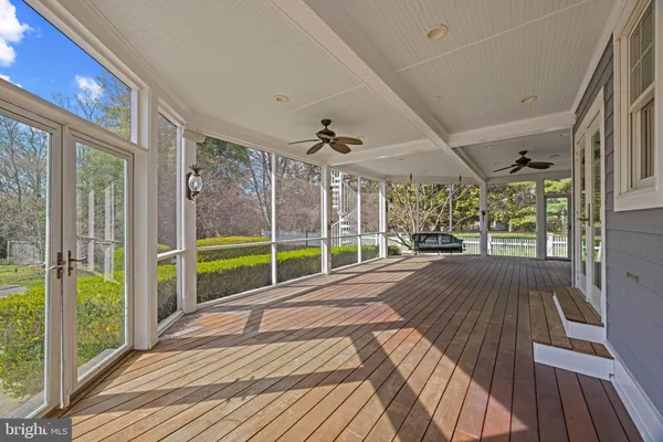 a view of a living room and balcony