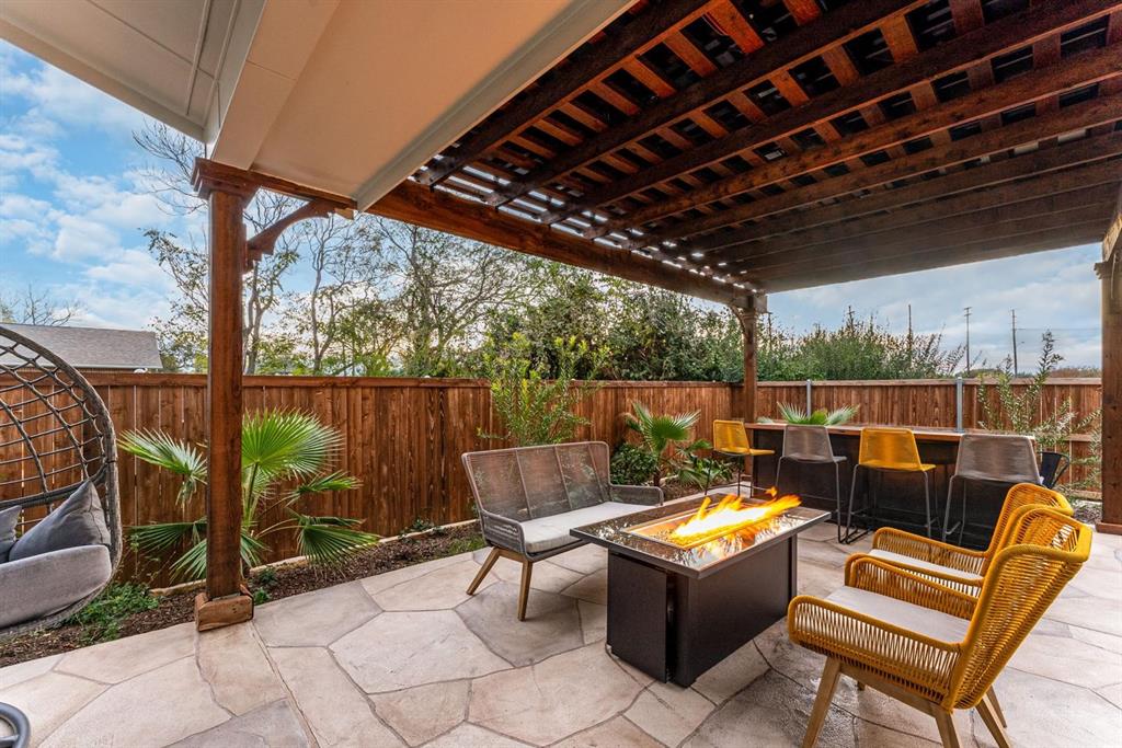 4013 Ivanhoe Lane Dallas, TX 75212 - Photo 37 of 38 View of patio / terrace with an outdoor fire pit