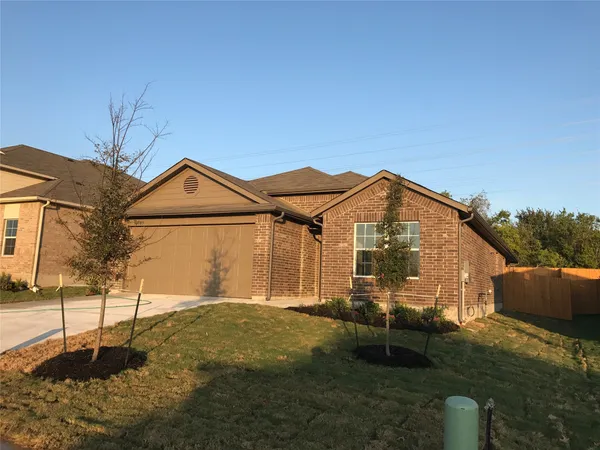 a view of a large house with a yard