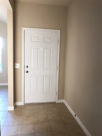 an empty room with a door