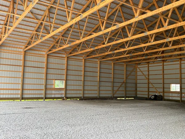 a view of a room with wooden walls and window