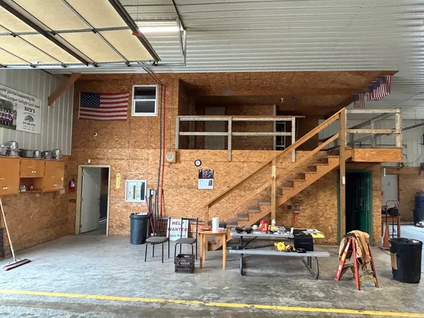 a view of backyard with seating space