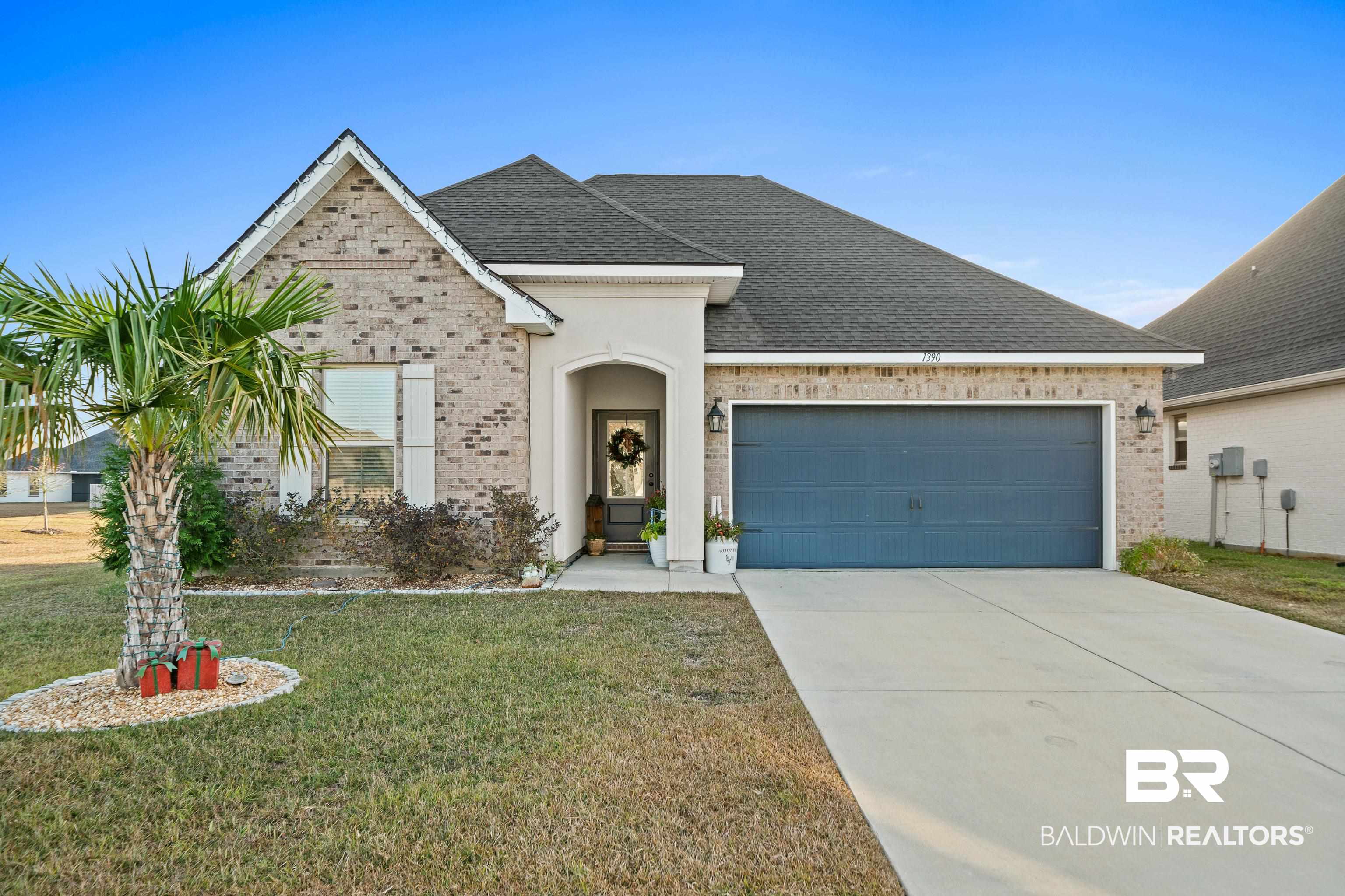 1390 Aldon Street Foley, AL 36535 - Photo 1 of 31 French provincial home featuring brick siding, a front yard, a shingled roof, and concrete driveway