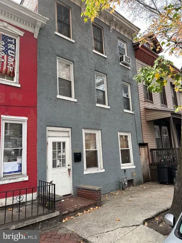 a front view of a house with many windows