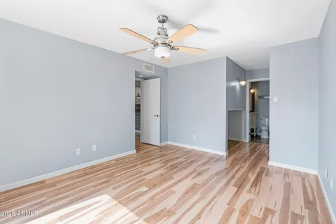 a view of a livingroom with a chandelier fan