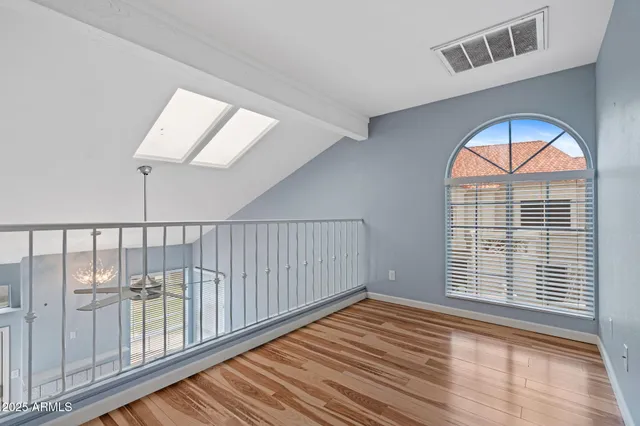 a view of front door with wooden floor