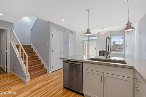 a kitchen with sink and window