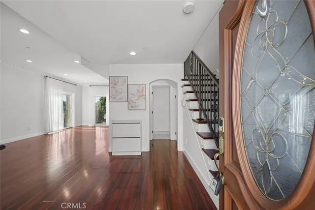 a view of entryway with wooden floor