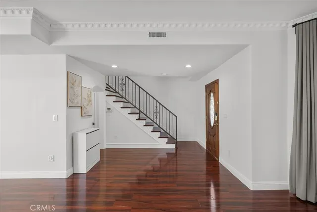 a view of kitchen with cabinets and wooden floor