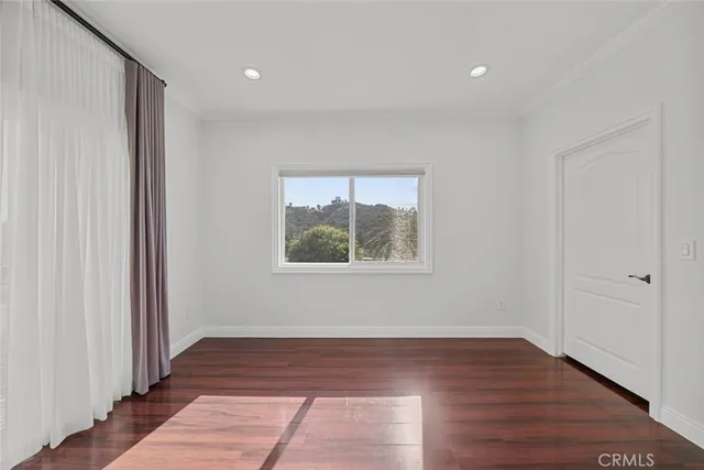 a bathroom with a granite countertop bathtub shower sink vanity and toilet