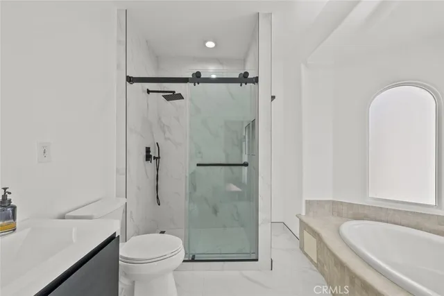 a bathroom with a tub and a sink