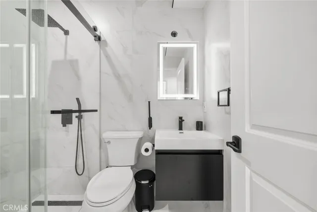 a bathroom with a shower and a sink