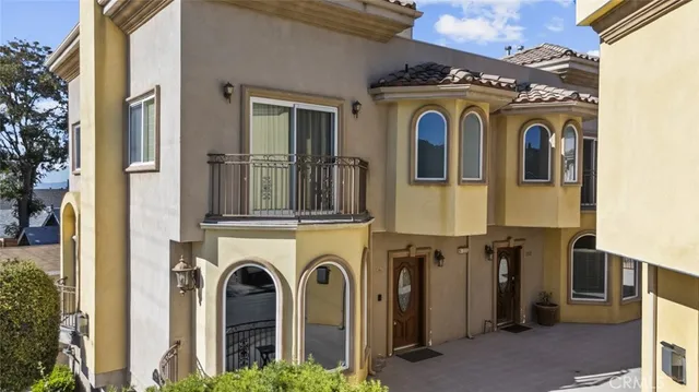 a view of a building with entryway and windows
