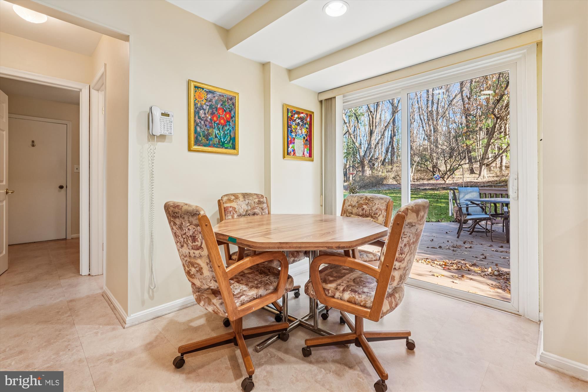 15417 Aylesbury Street Silver Spring, MD 20905 - Photo 16 of 65 a view of a dining room with furniture large window and wooden floor