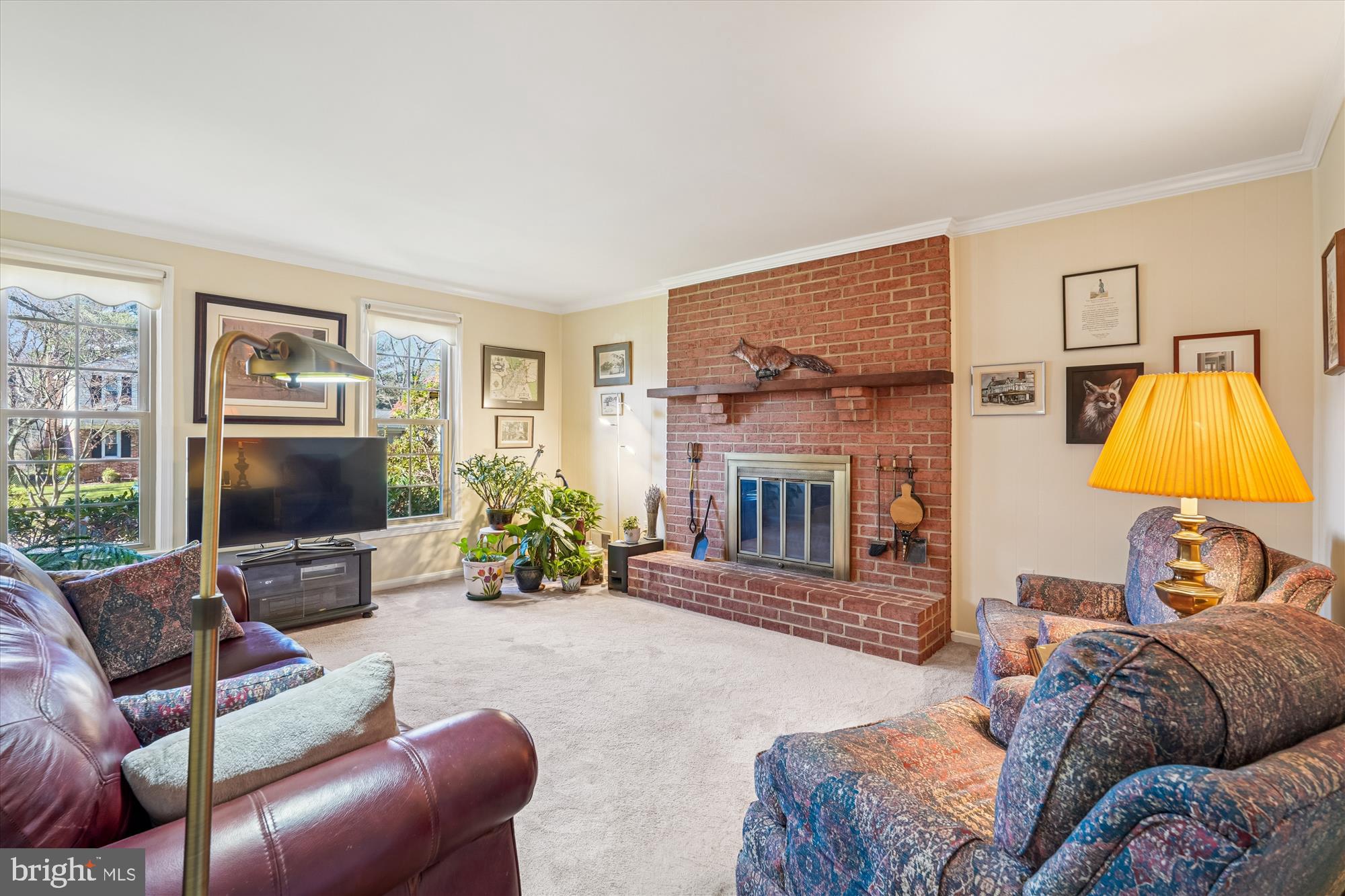 15417 Aylesbury Street Silver Spring, MD 20905 - Photo 18 of 65 a living room with furniture and a fireplace