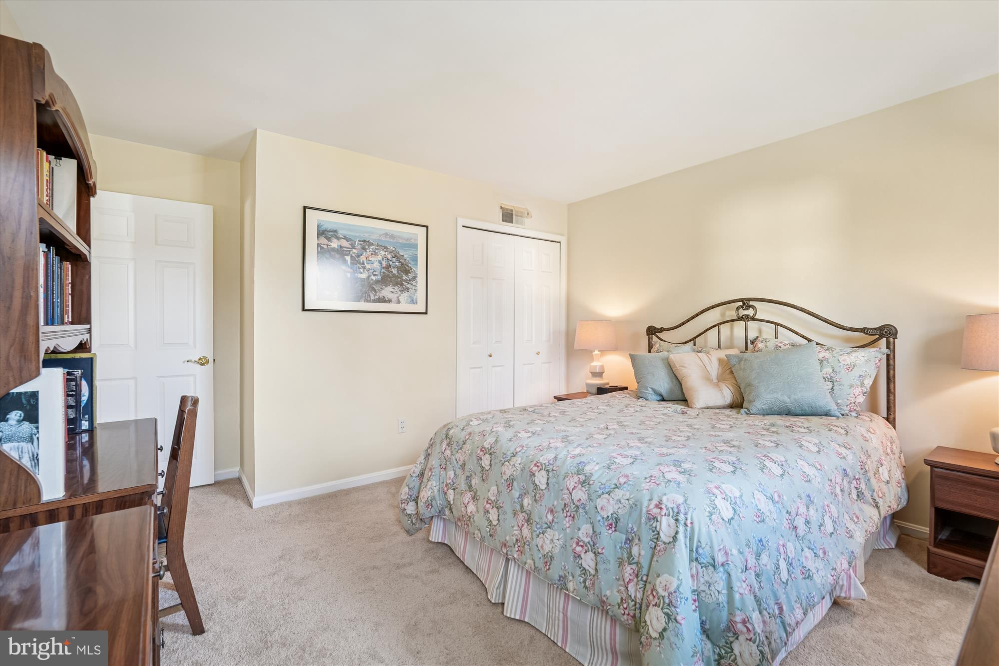 15417 Aylesbury Street Silver Spring, MD 20905 - Photo 26 of 65 a bedroom with a bed and a painting on the wall