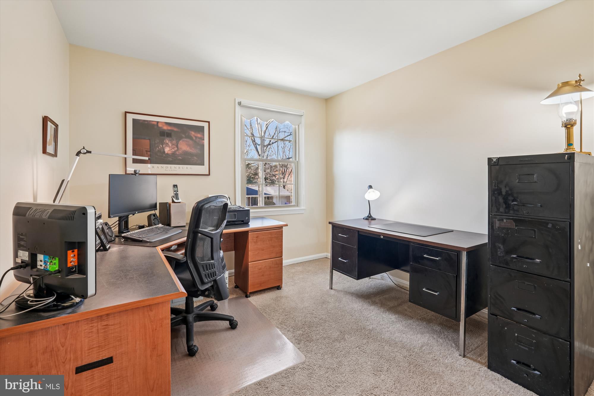 15417 Aylesbury Street Silver Spring, MD 20905 - Photo 28 of 65 a view of a workspace with furniture and a window