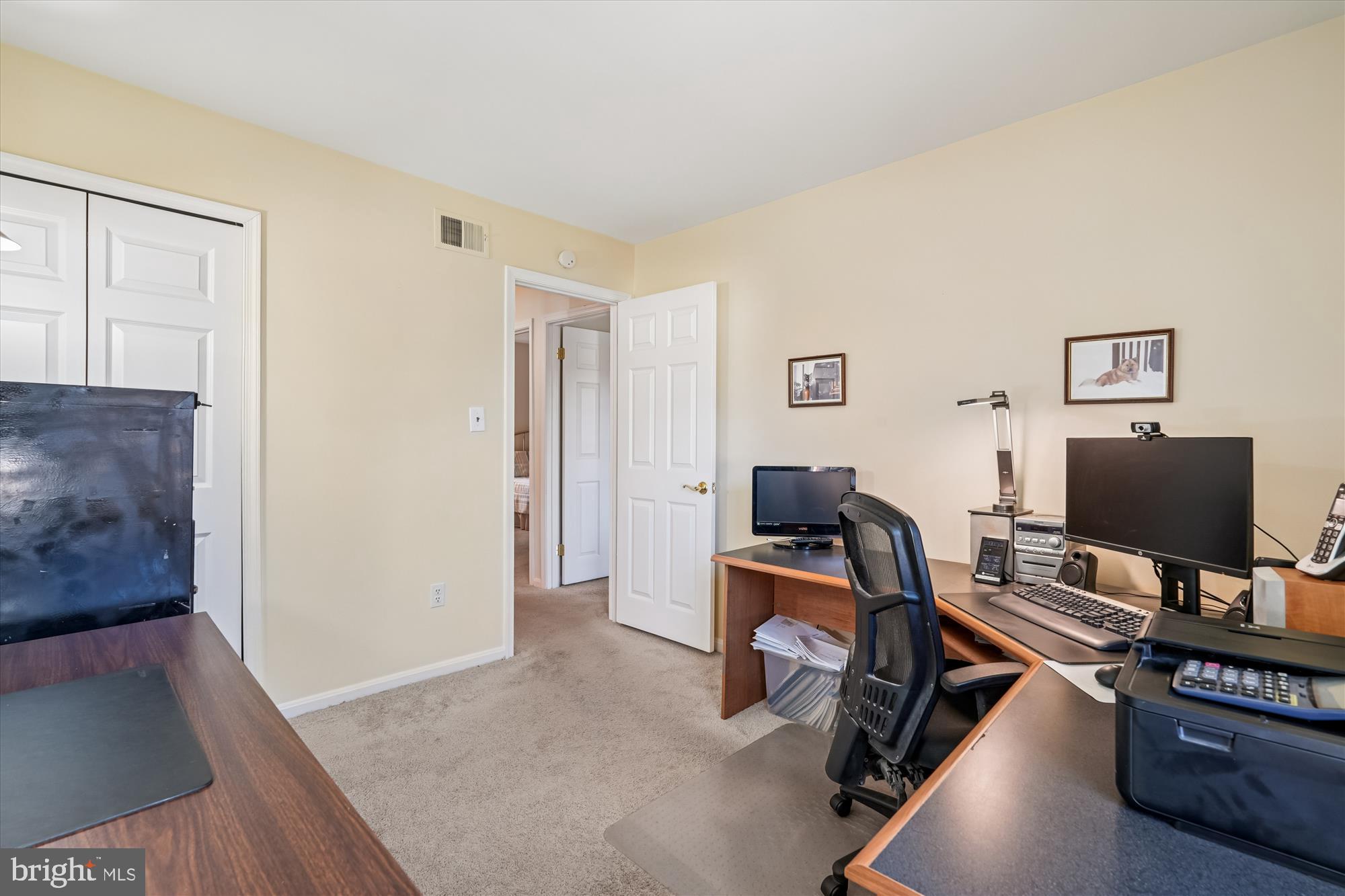 15417 Aylesbury Street Silver Spring, MD 20905 - Photo 29 of 65 a view of a workspace with furniture and a window