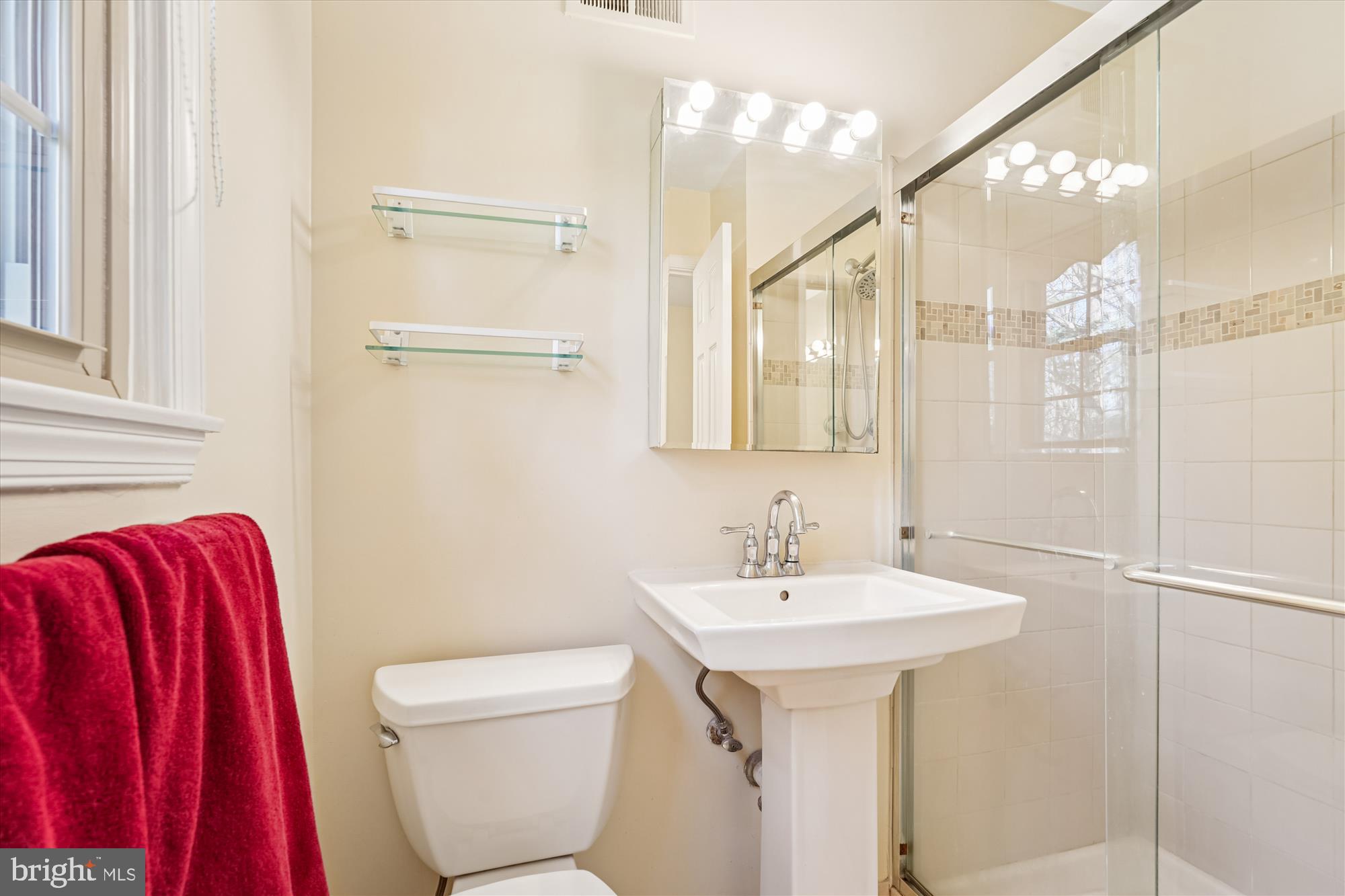 15417 Aylesbury Street Silver Spring, MD 20905 - Photo 37 of 65 a bathroom with a sink toilet and shower