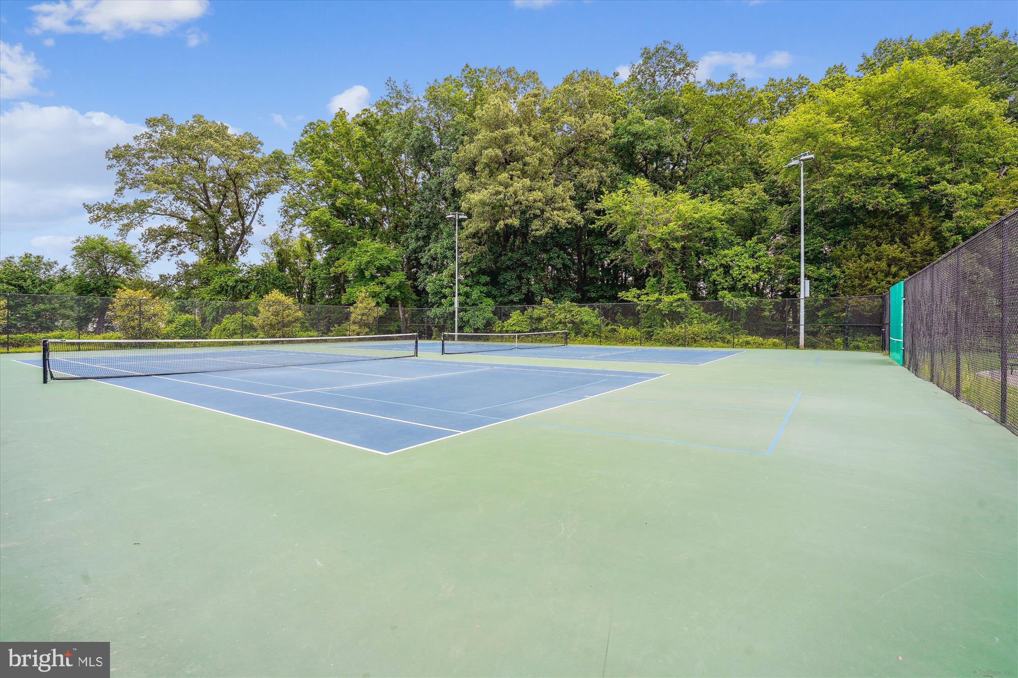 15417 Aylesbury Street Silver Spring, MD 20905 - Photo 48 of 65 a view of a tennis court
