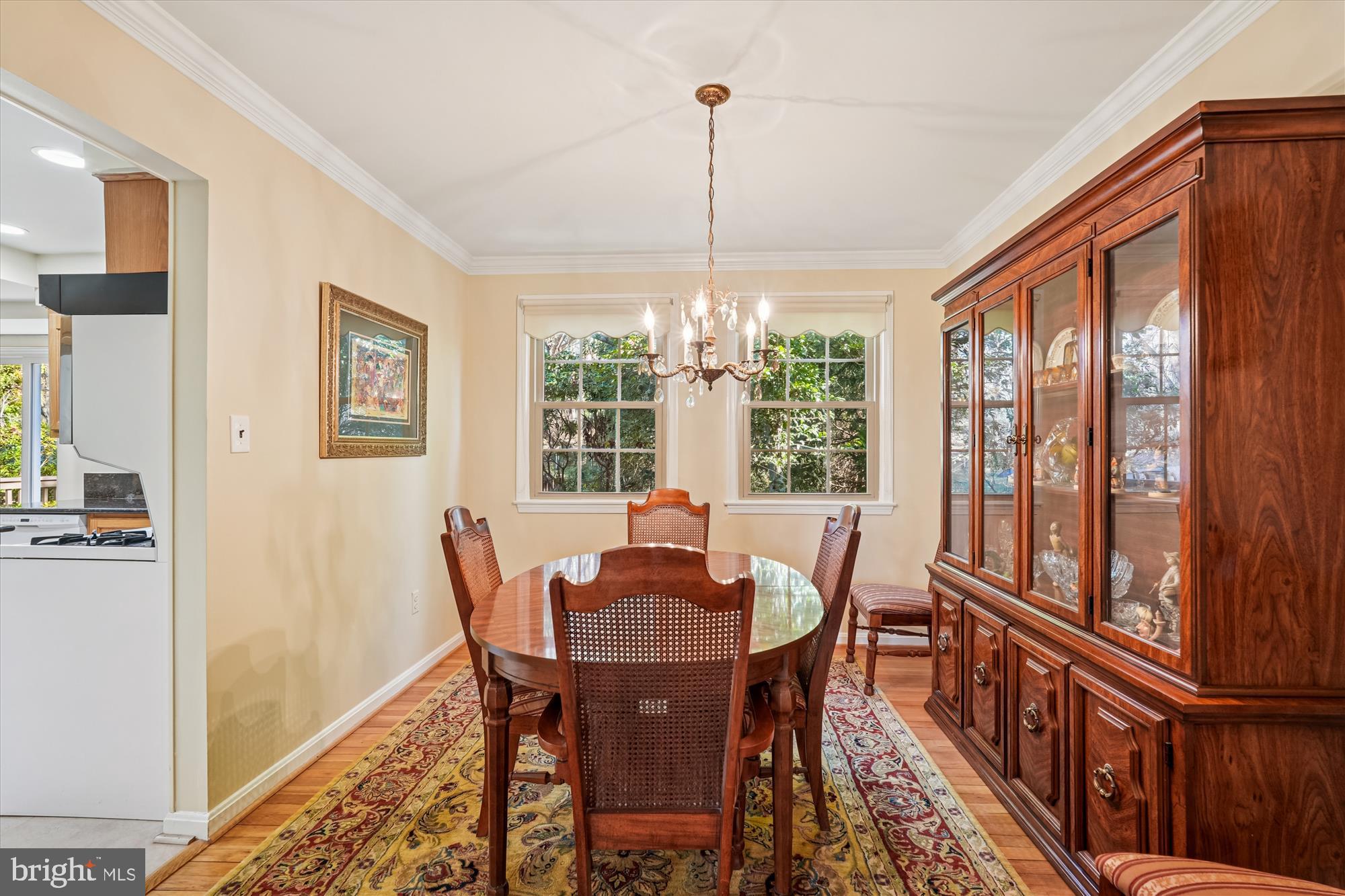 15417 Aylesbury Street Silver Spring, MD 20905 - Photo 10 of 65 a view of a dining room with furniture window and wooden floor