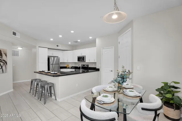 a bedroom with a large bed and a couch