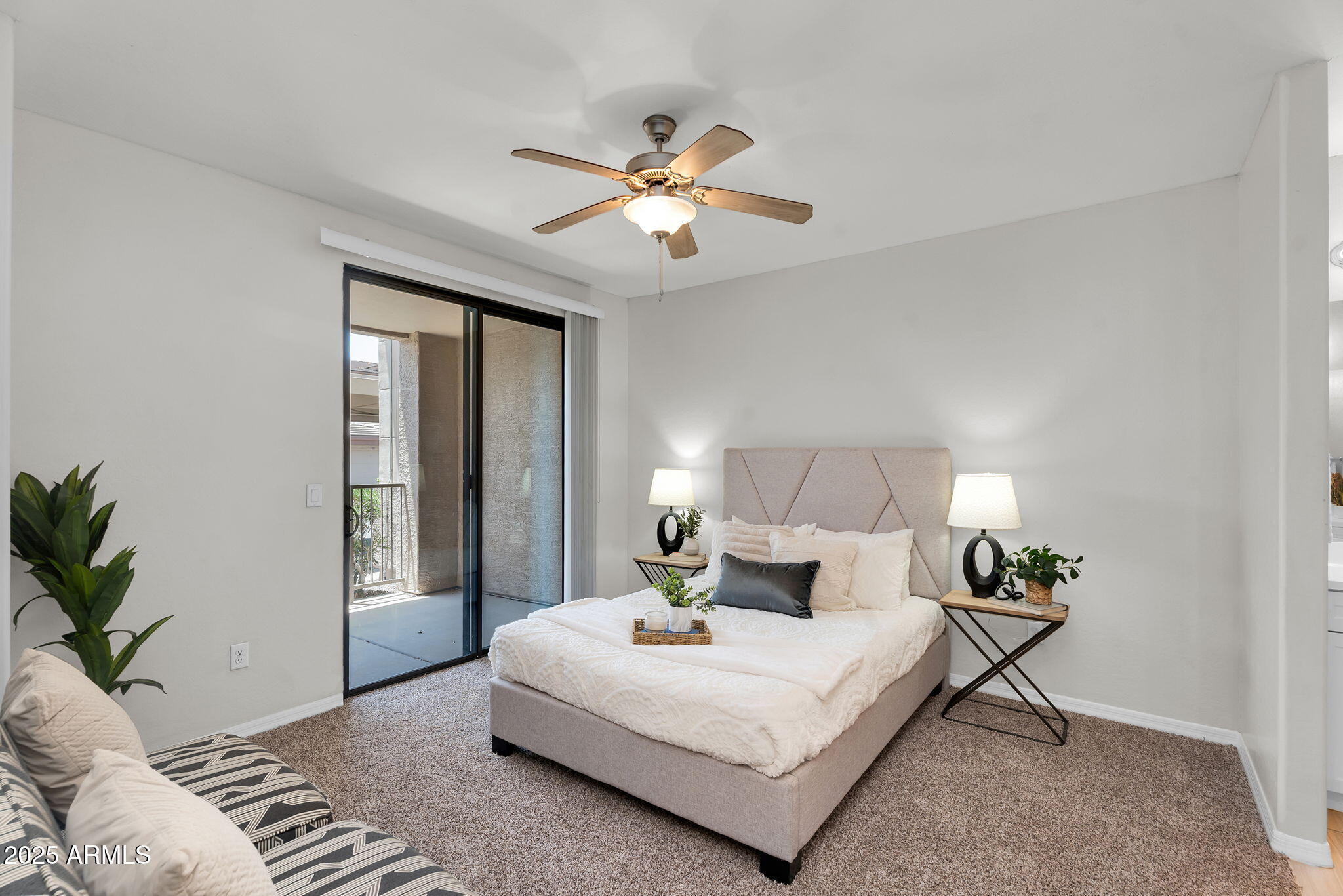 3330 South Gilbert Road, Unit 1075 Chandler, AZ 85286 - Photo 18 of 70 a bedroom with a large bed and a chandelier