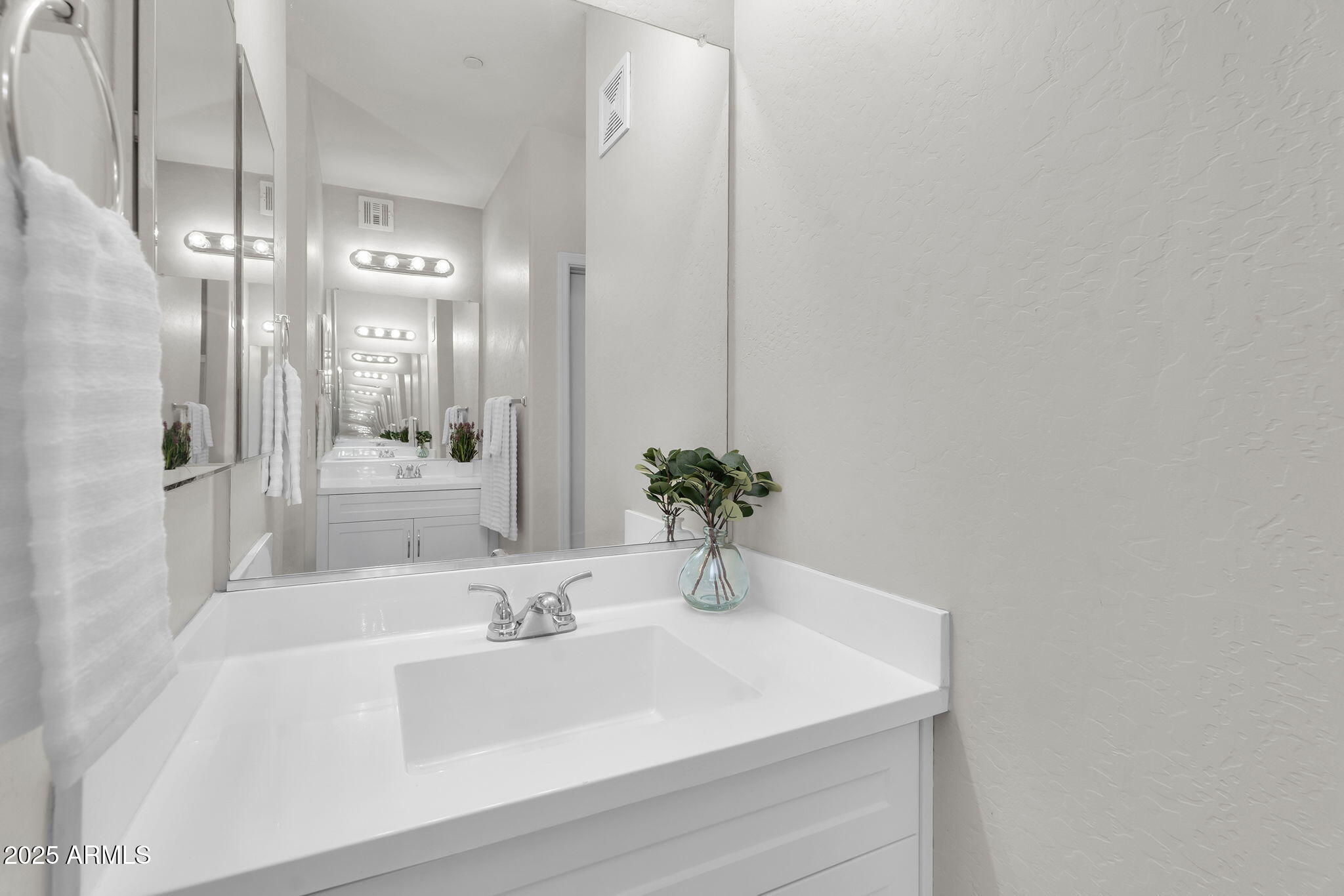 3330 South Gilbert Road, Unit 1075 Chandler, AZ 85286 - Photo 24 of 70 a bathroom with a sink and a mirror