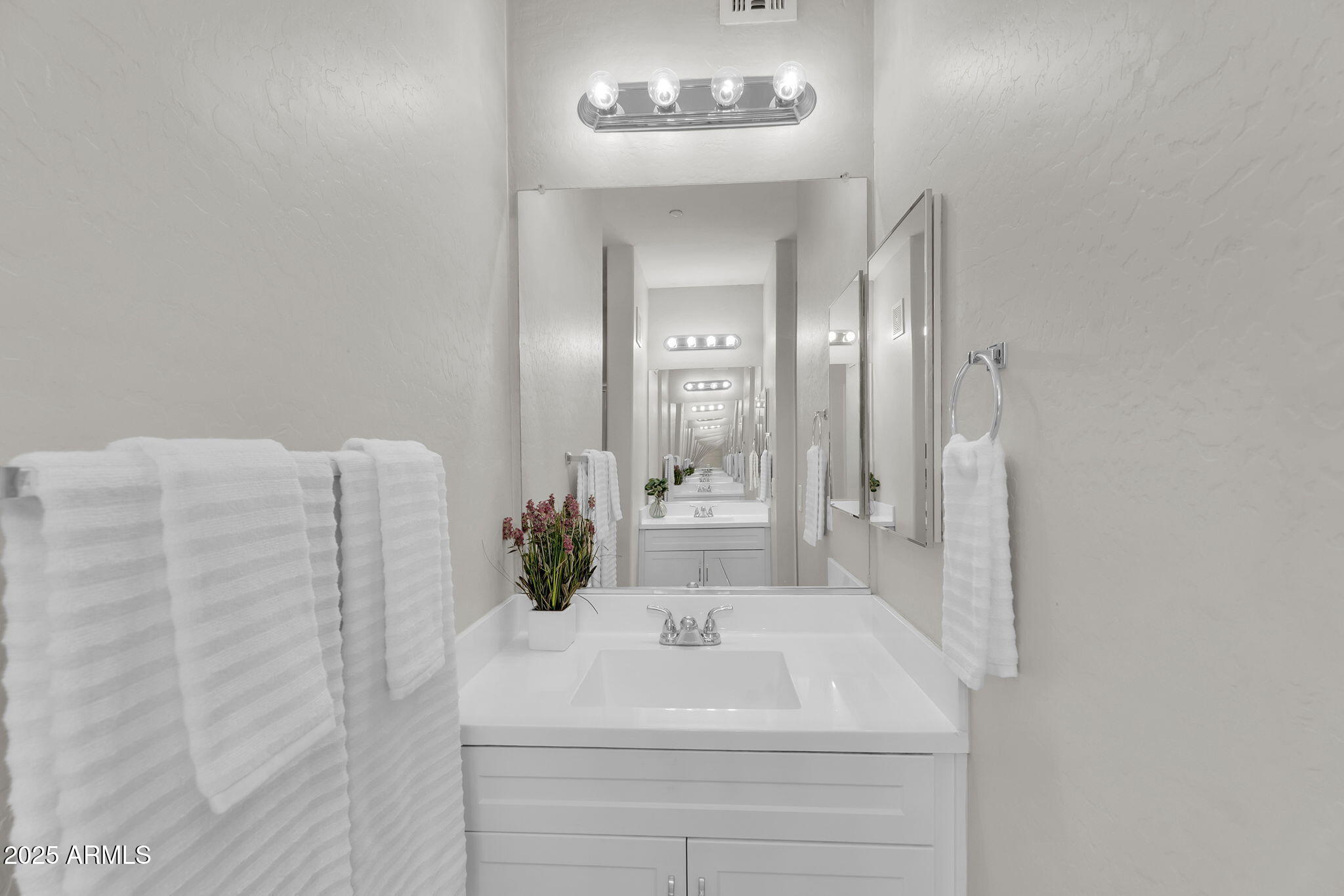 3330 South Gilbert Road, Unit 1075 Chandler, AZ 85286 - Photo 25 of 70 a bathroom with a sink and a mirror