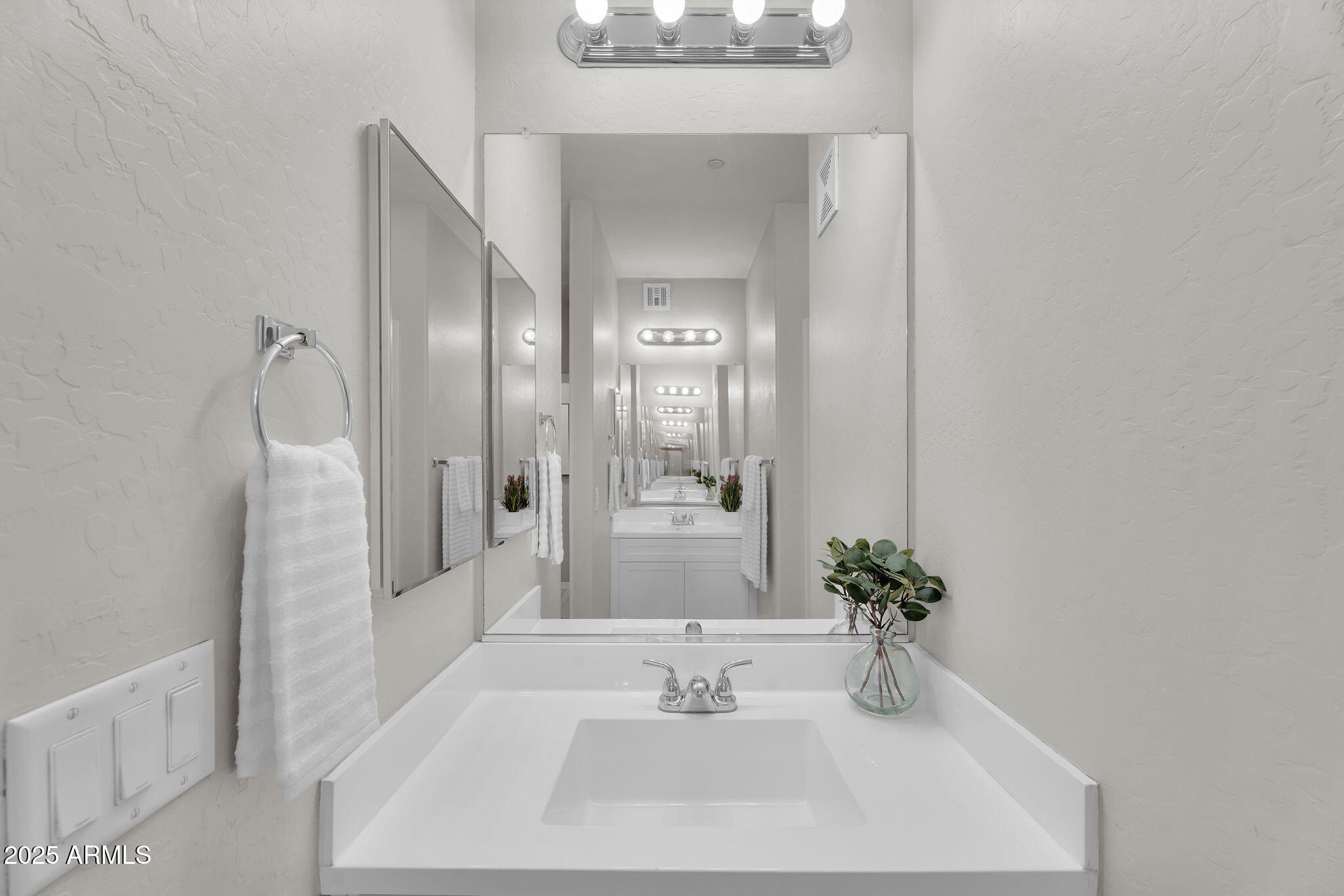 3330 South Gilbert Road, Unit 1075 Chandler, AZ 85286 - Photo 26 of 70 a bathroom with a sink and a mirror
